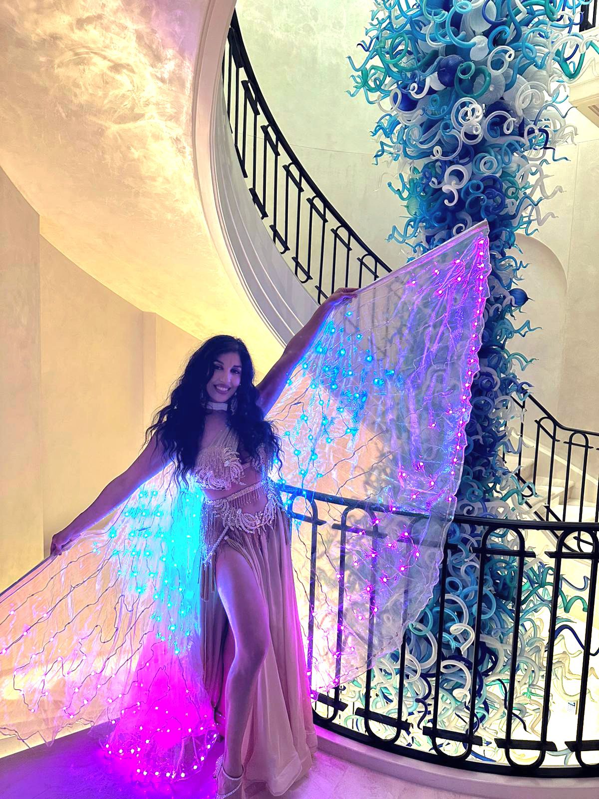 belly dancer by a glamorous staircase